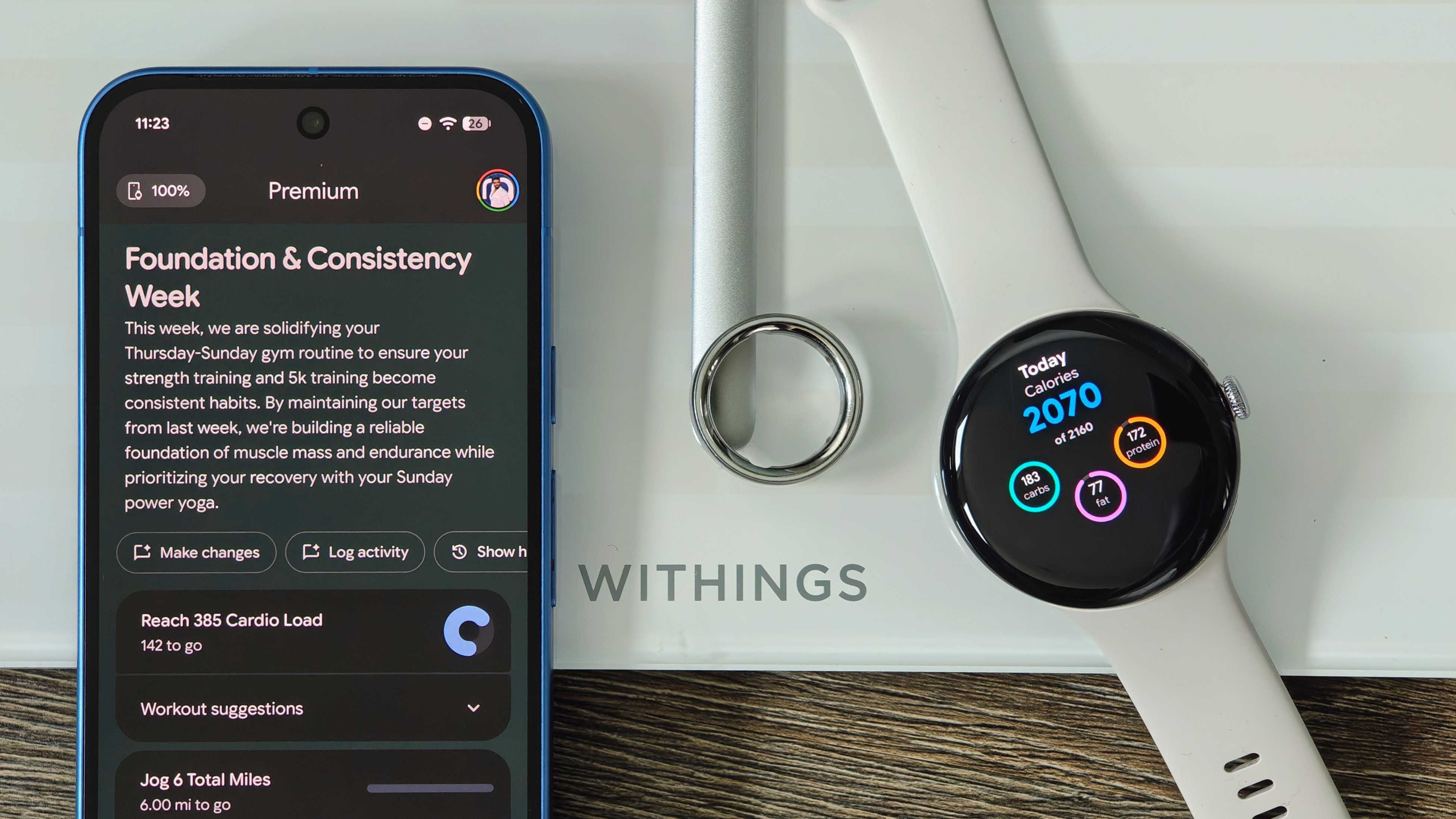 A Pixel 10, Pixel Watch 4, and Oura Ring 4 on a Withings smart scale