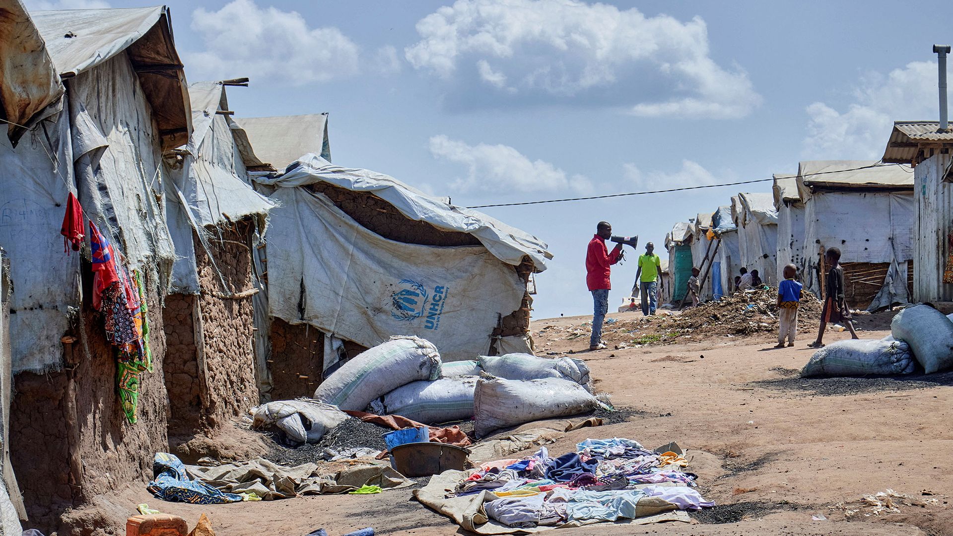 
                                A supervisor at the Kigonze camp for internally displaced persons urges residents to wash their hands as fears grow over the spread of Ebola, in Bunia, Democratic Republic of Congo
                            