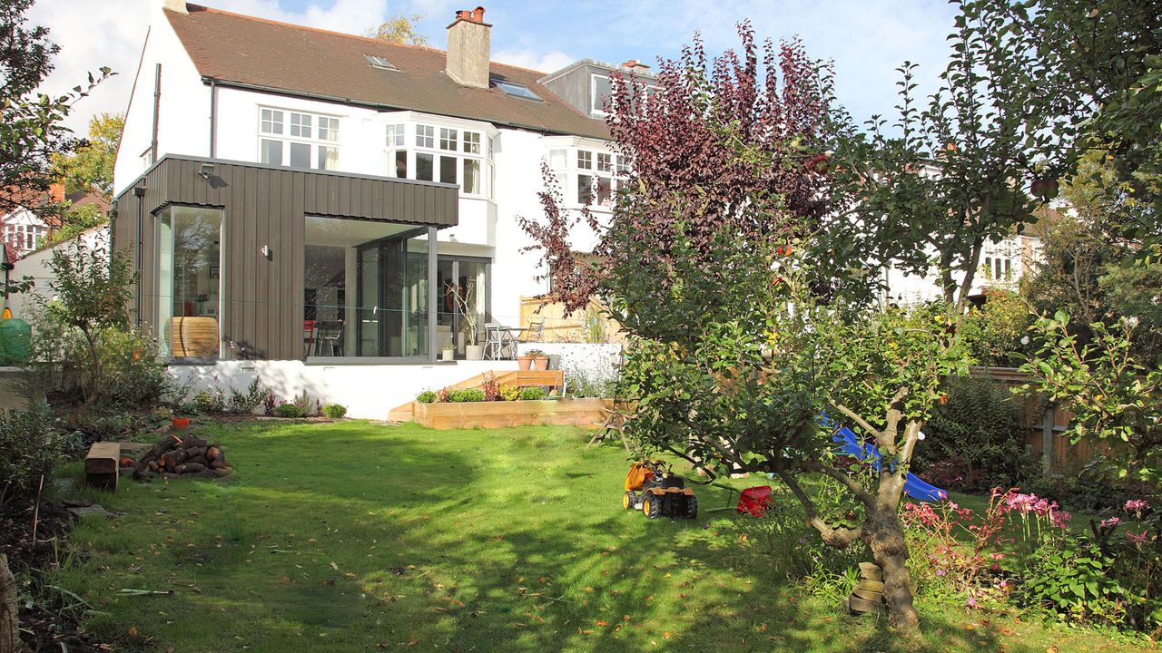 Contemporary extension on traditional style home, with views to an established garden