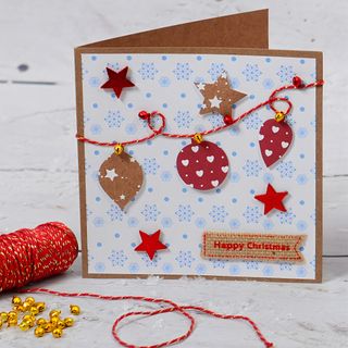 DIY Christmas card with bauble bunting, string and mini bells