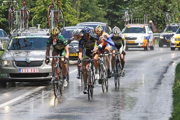 Riders in the early break load up with food.