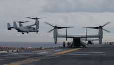 A Marine MV-22B Osprey aircraft lands on the deck of the USS Bonhomme Richard amphibious assault ship