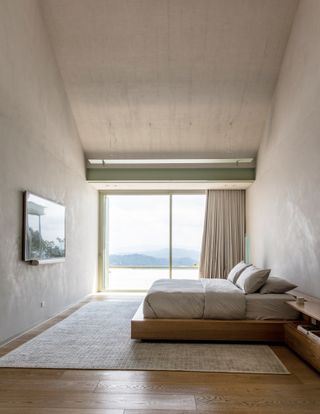 One of the three bedrooms, with floors in Brazilian walnut and walls and ceiling in clay plaster