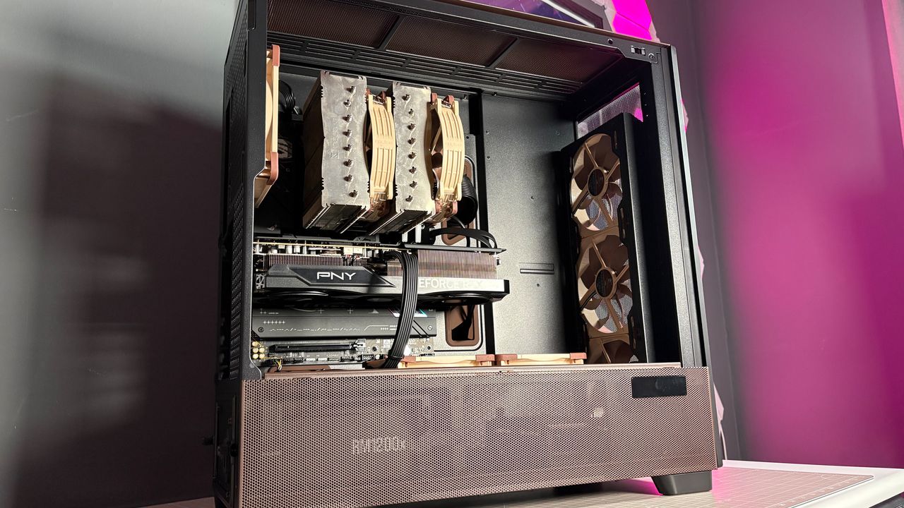 The Antec Flux Pro Noctua Edition on a desk with various parts disassembled.