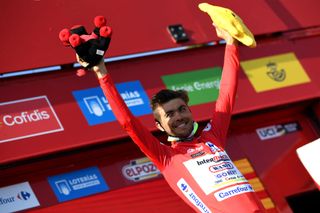 SANTA CRUZ DE BEZANA SPAIN AUGUST 31 Odd Christian Eiking of Norway and Team Intermarch Wanty Gobert Matriaux celebrates winning the red leader jersey on the podium ceremony after the 76th Tour of Spain 2021 Stage 16 a 180km stage from Laredo to Santa Cruz de Bezana lavuelta LaVuelta21 on August 31 2021 in Santa Cruz de Bezana Spain Photo by Tim de WaeleGetty Images