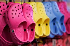 pink, yellow and blue crocs