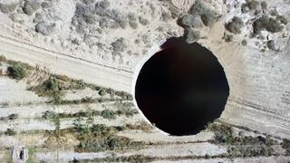 Overhead footage of the massive sinkhole, located in a rural area in Chile.