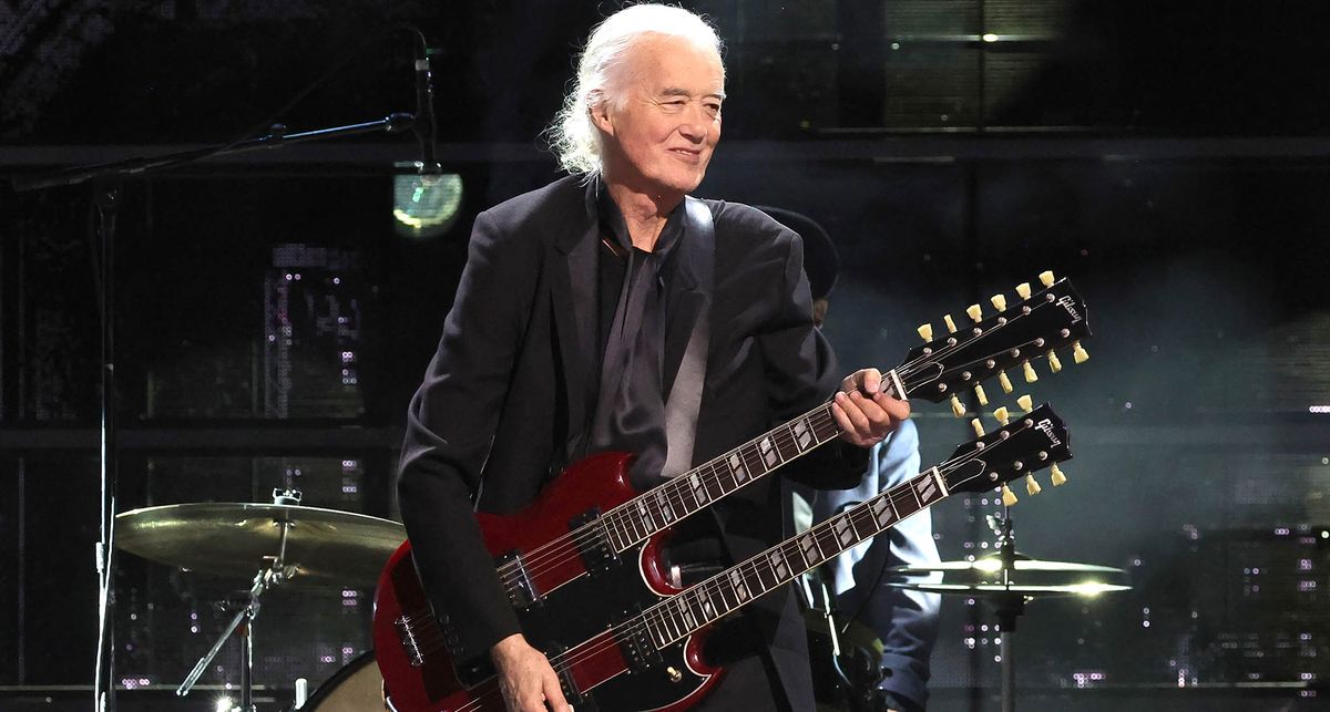 Led Zeppelin icon Jimmy Page plays his cherry red double-neck Gibson EDS-1275 at The Rock And Rock Hall Of Fame ceremony honouring Link Wray. He wears all black.