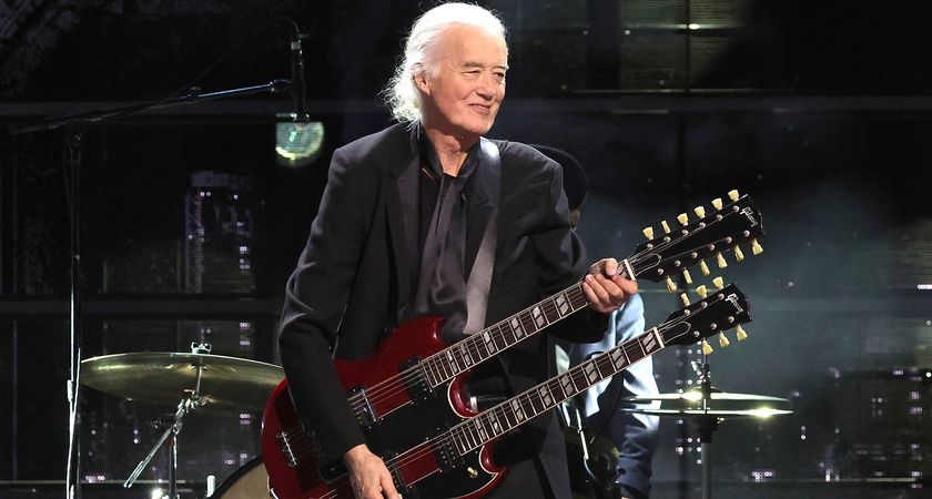 Led Zeppelin icon Jimmy Page plays his cherry red double-neck Gibson EDS-1275 at The Rock And Rock Hall Of Fame ceremony honouring Link Wray. He wears all black.