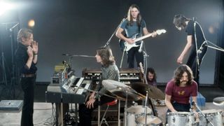 (L-R) Film director Adrian Maben, keyboardist Richard Wright (1943-2008), guitarist, songwriter and lead singer David Gilmour, drummer Nick Mason and bassist, singer and songwriter Roger Waters, all members of Pink Floyd, during the filming of "Live at Pompeii" at Studio Europasonor in Paris, France, December 1971. 