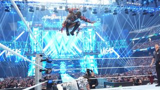 Scenes from WWE Wreslemania 42 with wrestlers making entrances in front of huge digital displays.