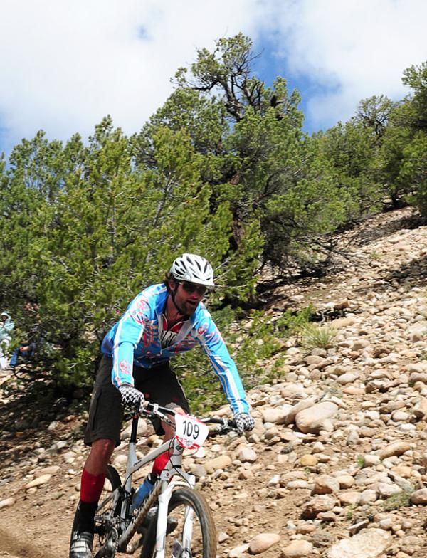 Chad Cheeny on a rocky off-camber section of trail.