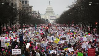 Protesters walk up Pennsylvania Avenue during the Women's March on Washington, with the U.S. Capitol in the background, on Jan. 21, 2017 in Washington, D.C.