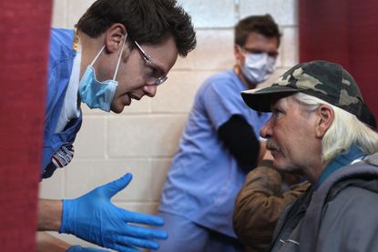 A homeless veteran gets a dental checkup. 