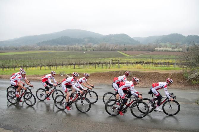 The team rolls through vineyards west of Santa Rosa in light rain.