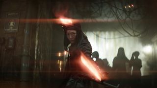 Nemesis (Doona Bae) readies her swords in Rebel Moon - Part One: A Child of Fire