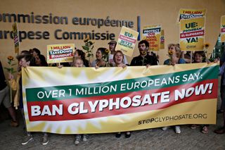 Activists take part in a protest against Monsanto's production and sale of glyphosate products in Brussels, Belgium on Jul. 19, 2017.