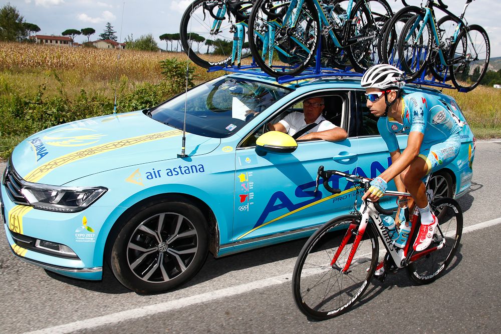 Fabio Aru (Astana) chats with the team director during stage 2 at Giro della Toscana