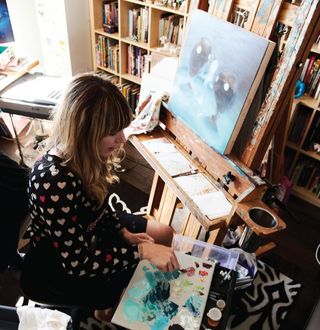 Tara McPherson at work in her studio in Brooklyn, New York – oils are a current favourite medium.