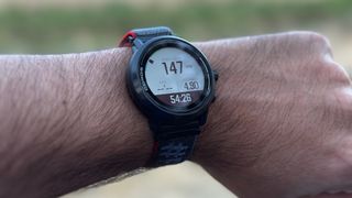 The in-workout data screen showing heart rate, distance, and other metrics on the COROS APEX 2