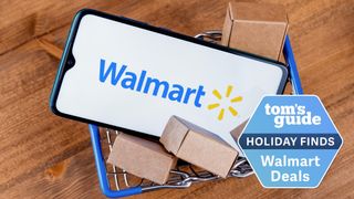 Mini shopping cart holding smartphone with Walmart logo on its screen