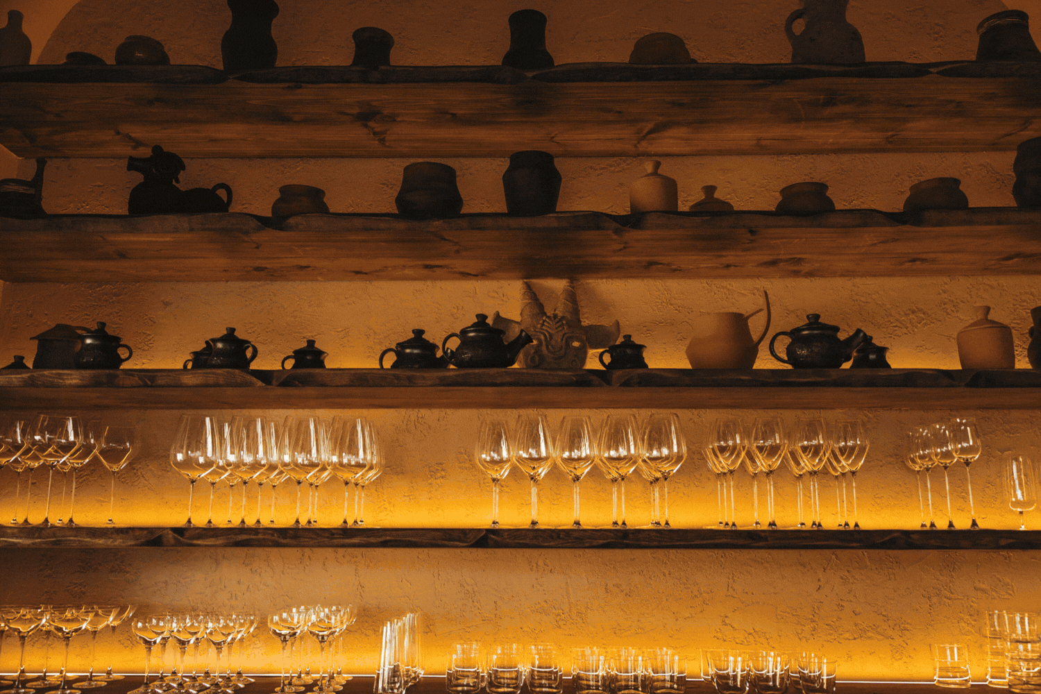 A rotating gif depicting the wood-heavy, crafty interiors of a restaurant and its equally artisanal, beautiful plates.