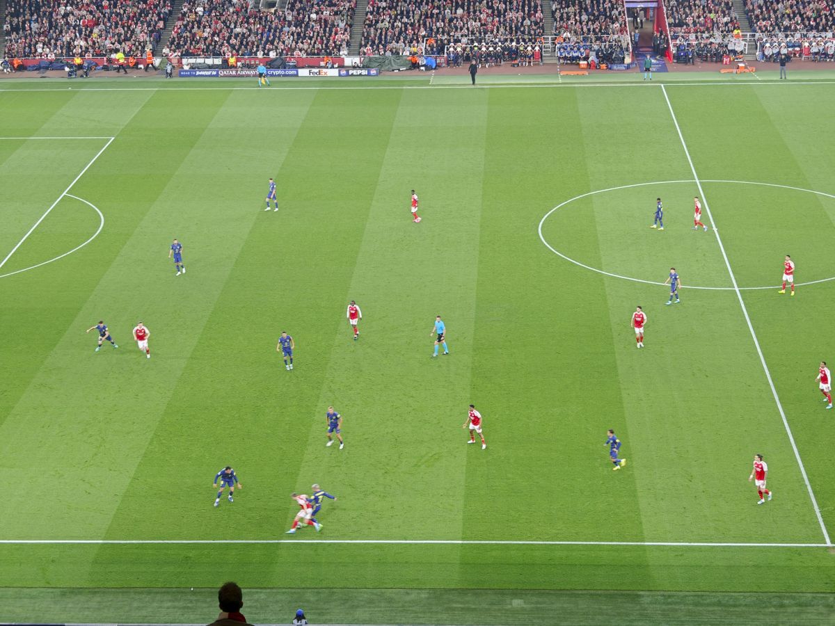 A Champions League soccer match between Arsenal and Atletico Madrid, as seen from the upper stand at the Emirates stadium, London. Zoomed in photos of the players