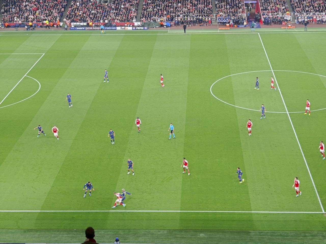 A Champions League soccer match between Arsenal and Atletico Madrid, as seen from the upper stand at the Emirates stadium, London. Zoomed in photos of the players