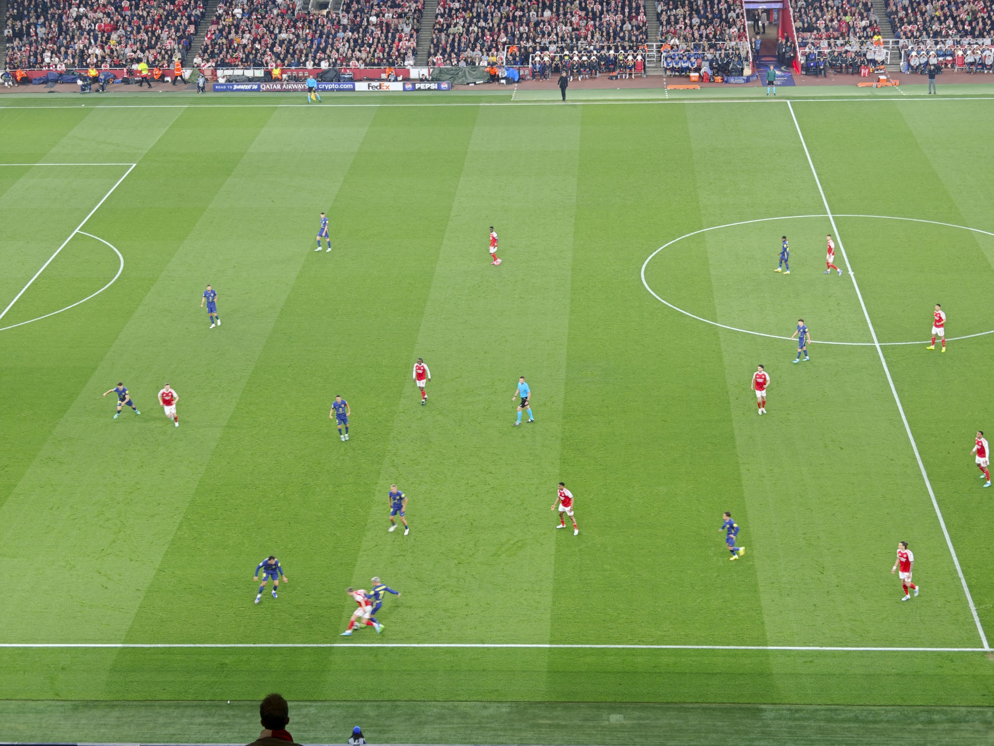 A Champions League soccer match between Arsenal and Atletico Madrid, as seen from the upper stand at the Emirates stadium, London. Zoomed in photos of the players