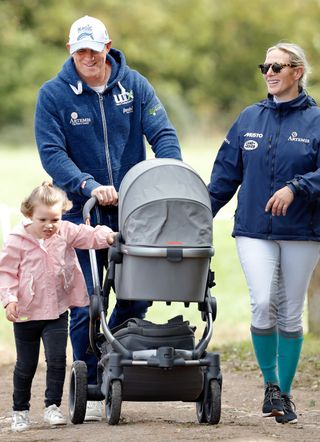 Mike and Zara Tindall out with their daughters, Mia, and Lena (in the pram)