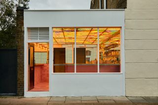 The front façade of a wine bar and ice cream parlor lets passersby have a peek of its whimsical, retro-inspired décor