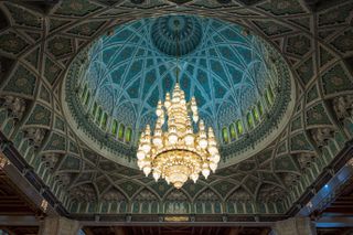 A massive chandelier at the Sultan Qaboos Grand Mosque