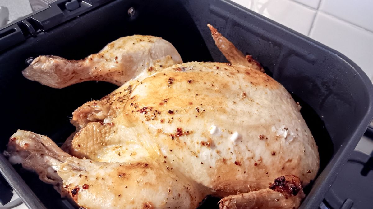 Whole chicken partly cooked using the Cosori smart meat thermometer