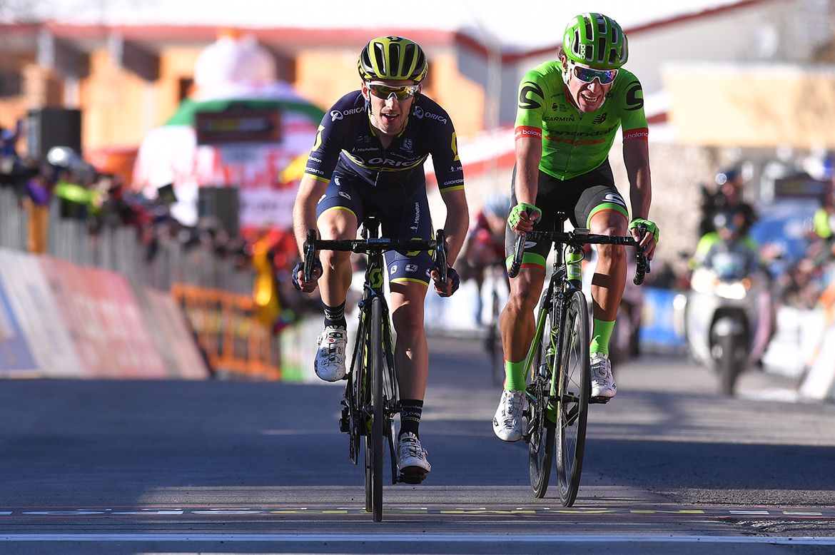 Adam Yates leads Rigoberto Uran across the line.