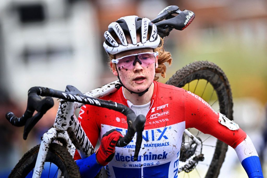 Dutch rider Puck Pieterse carries her bike as she competes in the womens elite race at the Urban Cross Kortrijk cyclocross cycling event the second stage in the X2O Badkamers Trofee Veldrijden competition in Kortrijk on November 25 2023 Photo by JASPER JACOBS Belga AFP Belgium OUT Photo by JASPER JACOBSBelgaAFP via Getty Images