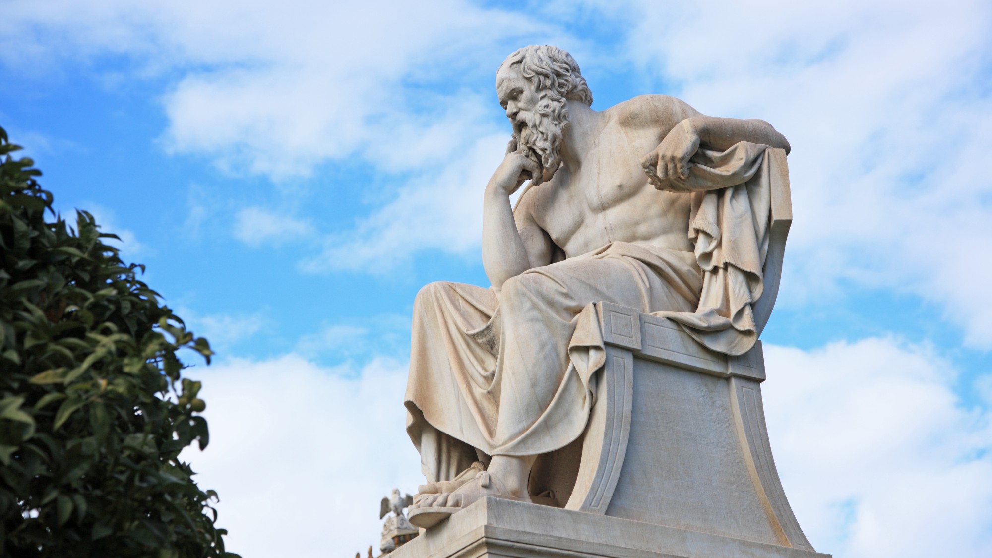 A statue of Socrates in a contemplative pose