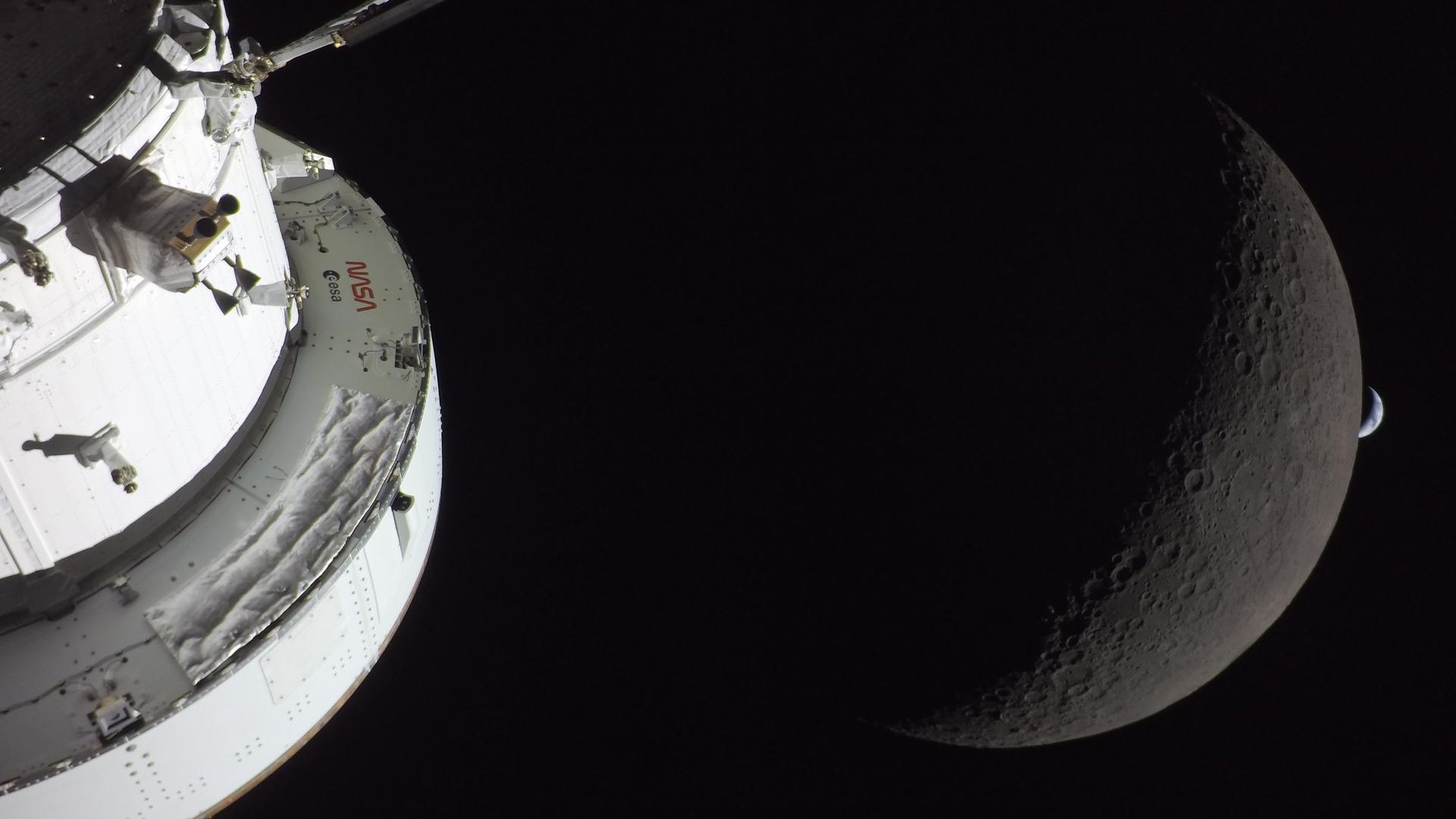 a white cone-shaped spacecraft dominates the left side of the image, while a crescent blue-white earth peeks from behind a dark grey moon on the right