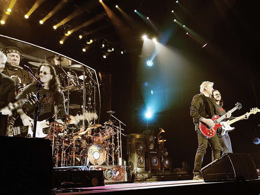 Rush perform onstage as part of their recent Time Machine tour.