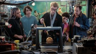 Lucky (Celese O'Connor), Trevor (Finn Wolfhard) Lars (James Acaster), Podcast (Logan Kim) and Ray (Dan Aykroyd) testing the orb in Ghostbusters: Frozen Empire