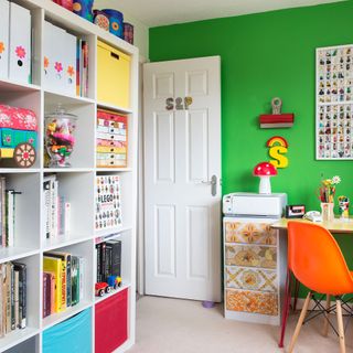 Bright green home office, homework area with whit open shelving unit
