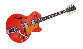 The Trans Orange finish very obviously hints at the Gretsch influence