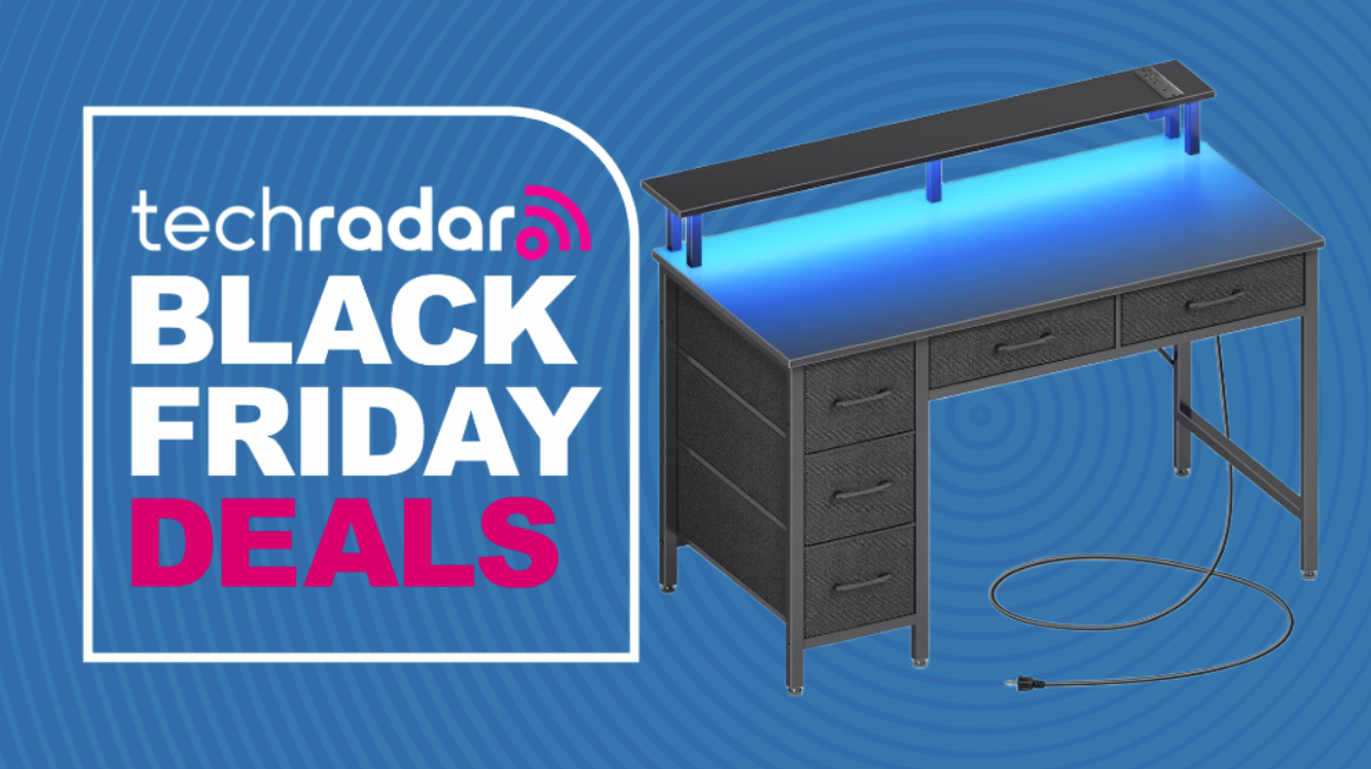 Seventable computer desk on a blue background next to a TechRadar badge that reads 'Black Friday deals'