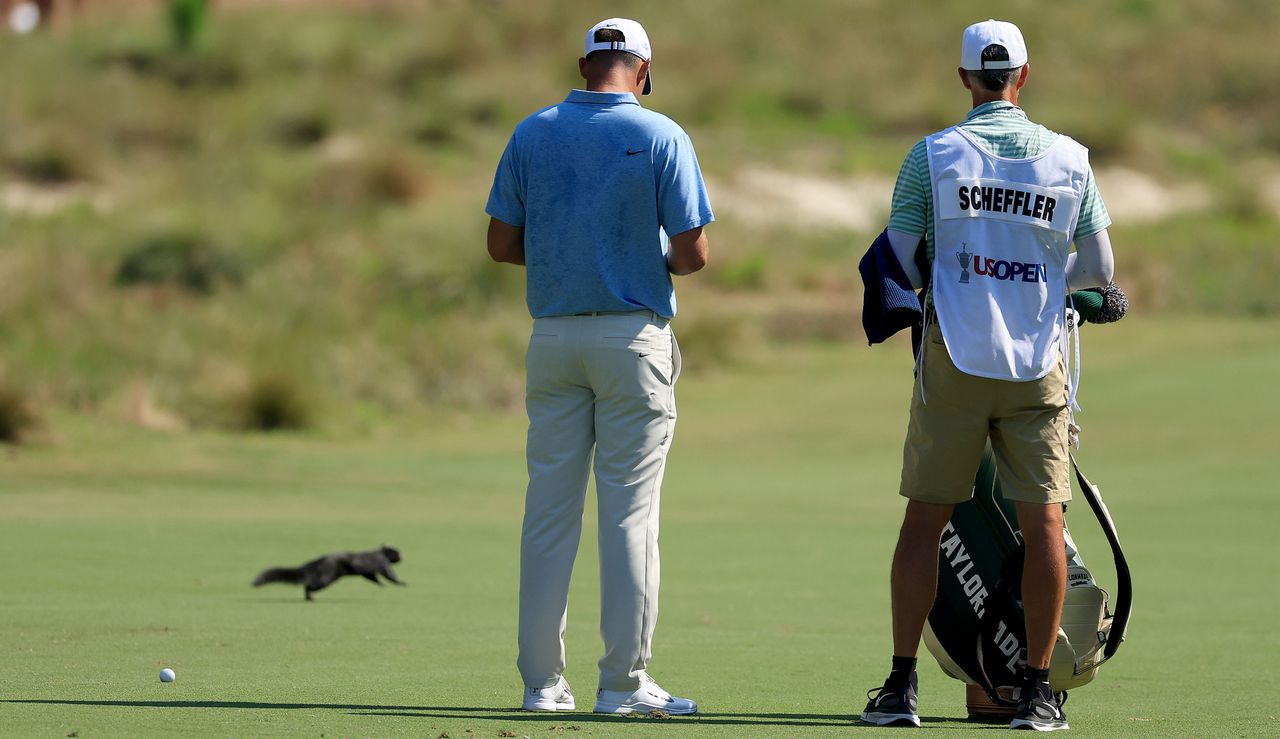 Scottie Scheffler chats to his caddie during the US Open