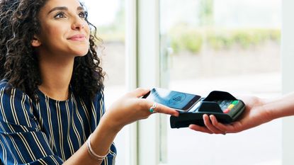 Woman making a contactless payment 