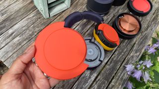 Dyson OnTrac wireless headphones showing customisation options on wooden table