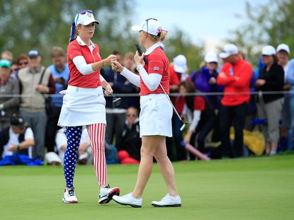 Paula Creamer (left) and Morgan Pressler (R) of the United States Team shake hands at the 7th hole during the afternoon fourballs on the opening day of the 2015 Solheim Cup