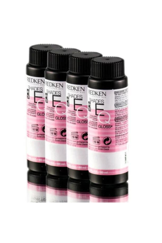 four Redken demi-permanent hair dyes side by side on a white background