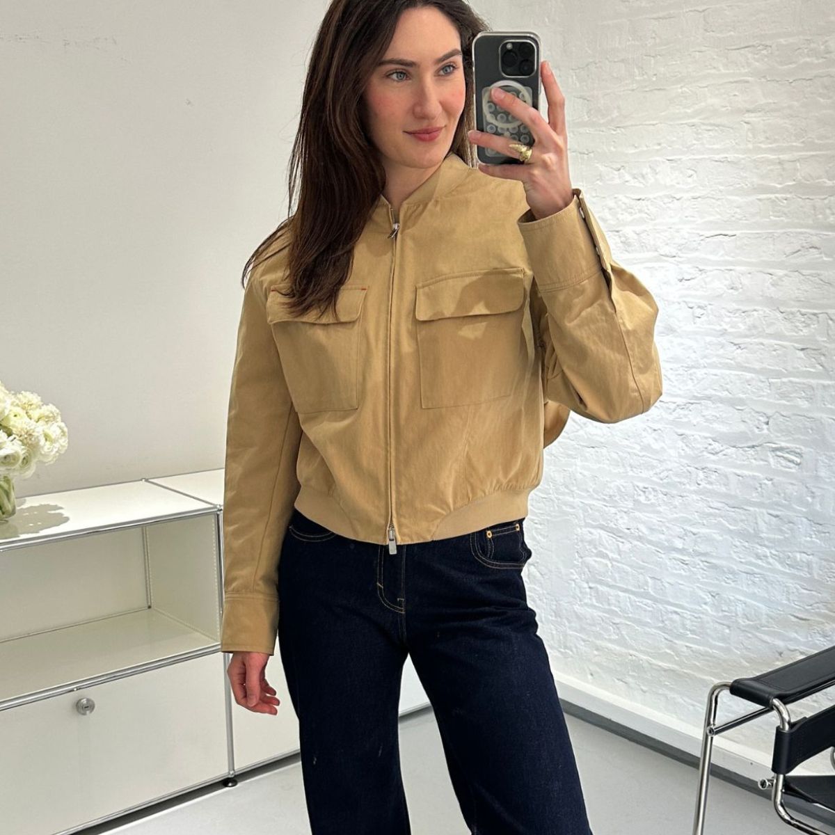 Natalie wearing beige jacket