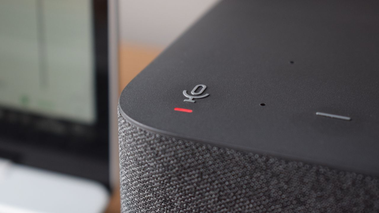 Close-up photo of the Logitech Logi Dock docking station's mute audio button and beamforming mics positioned at the front-top of the device.