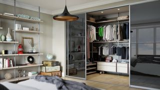 Signature mirrored walk-in wardrobe from Spaceslide in a bedroom
